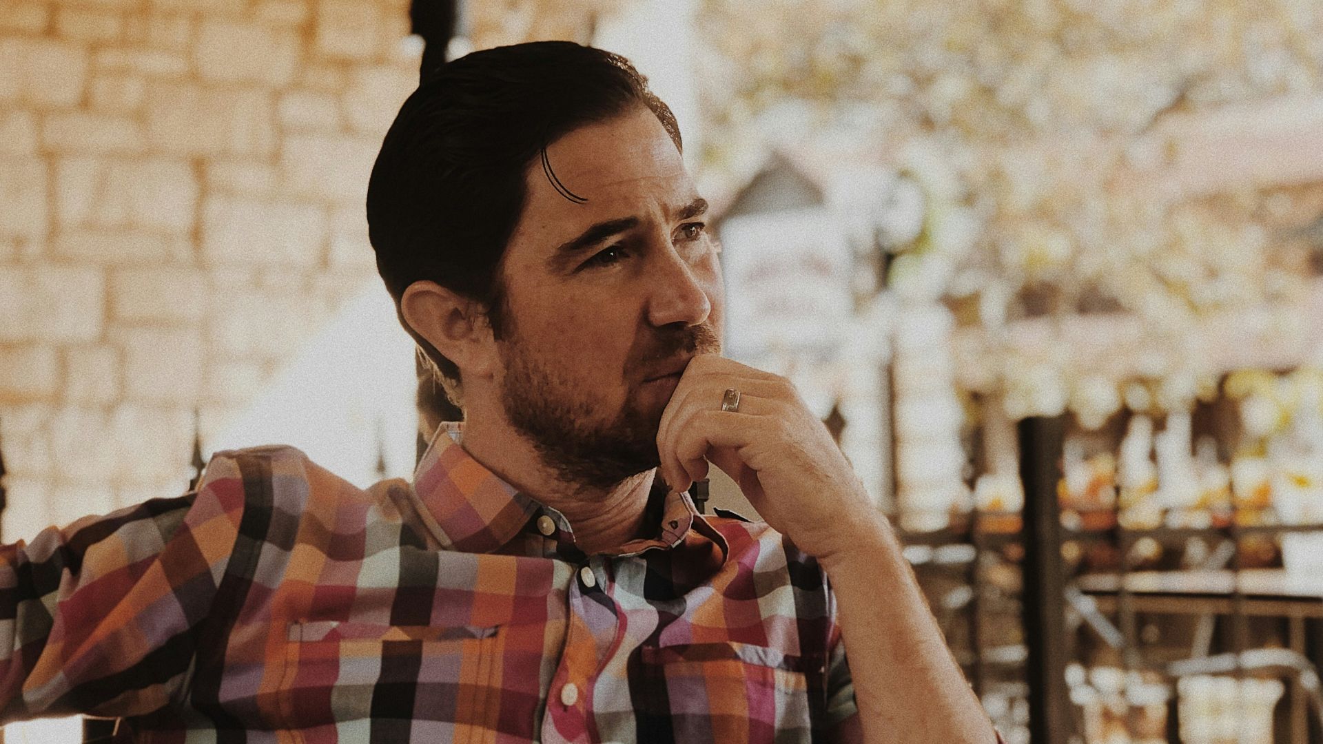 man in red and black plaid dress shirt