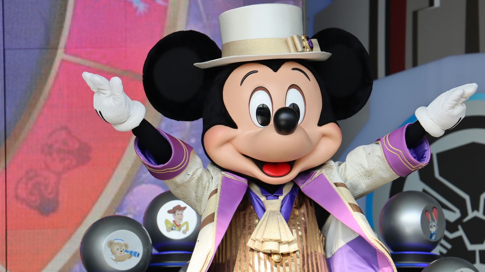 a mickey mouse dressed in a top hat and suit