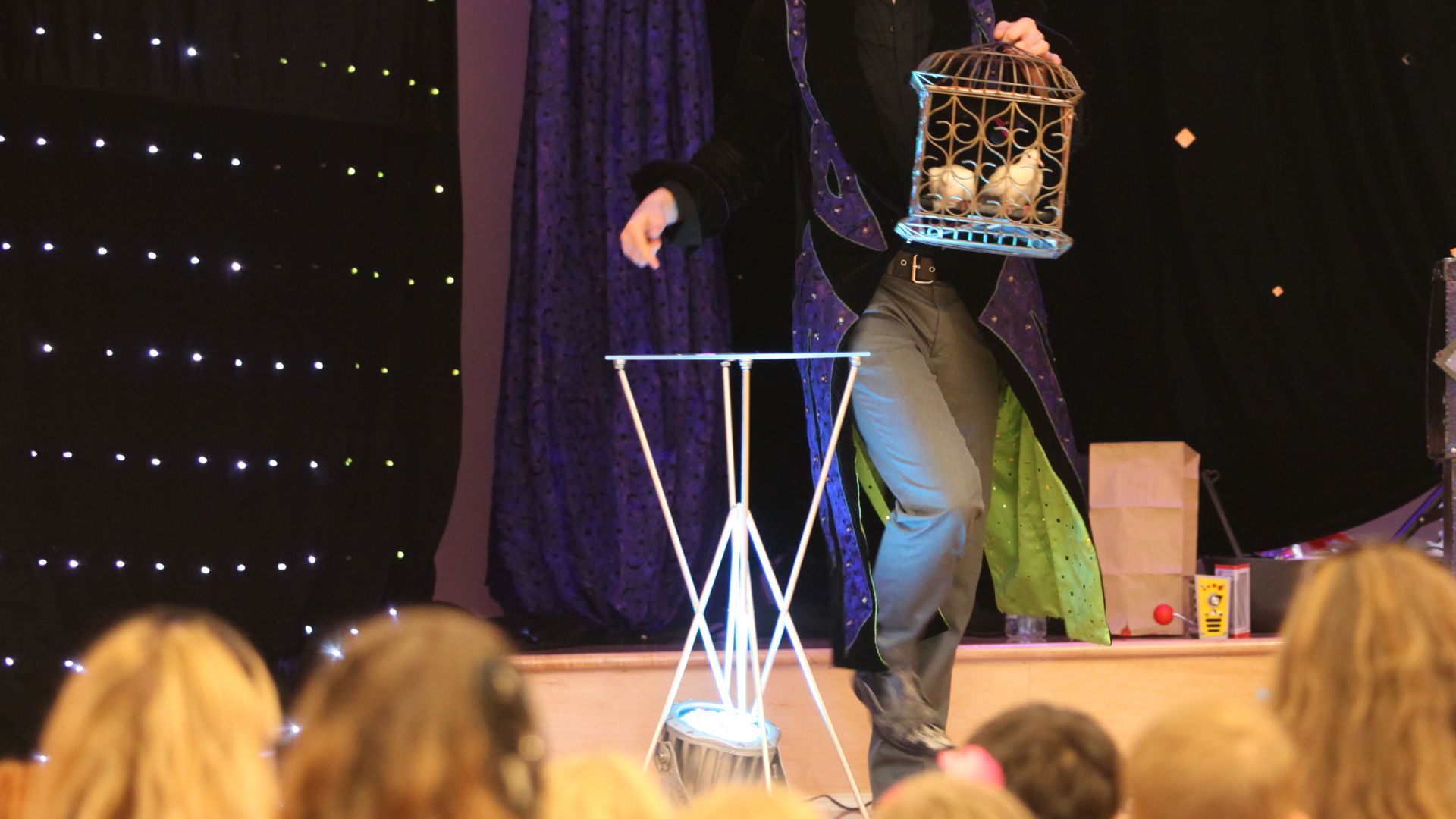 Magician Jeff Jones dazzles the crowd with doves he pulled from thin air at the grand finale of the summer reading program at Marston Pavilion aboard Marine Corps Base Camp Lejeune Aug. 3. Children between the ages of four and 11 were amazed as Jones made