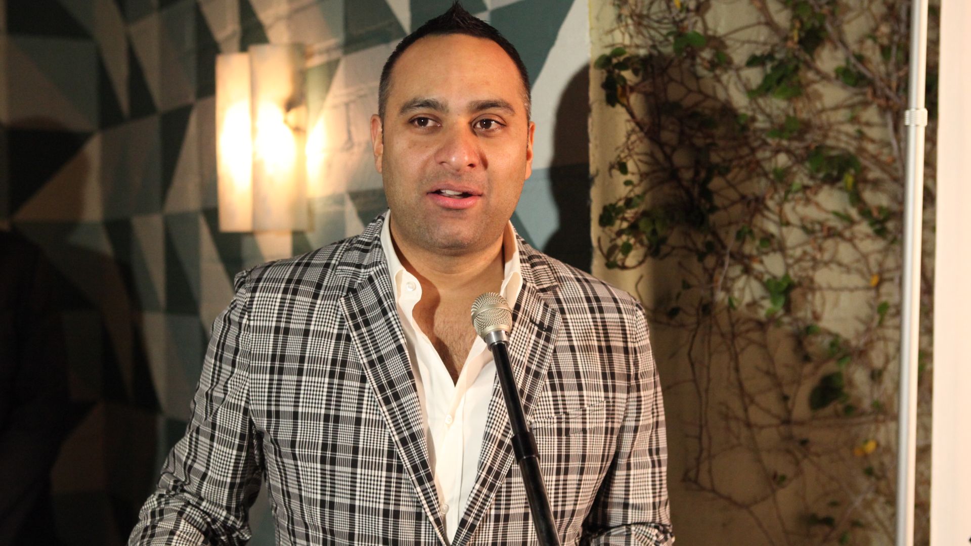 Russell Peters welcoming guests to the CFC & Variety-hosted reception for the Telefilm Canada Features Comedy Lab. To learn more about the Canadian Film Centre, please visit: cfccreates.com Photo by Jesse Grant.