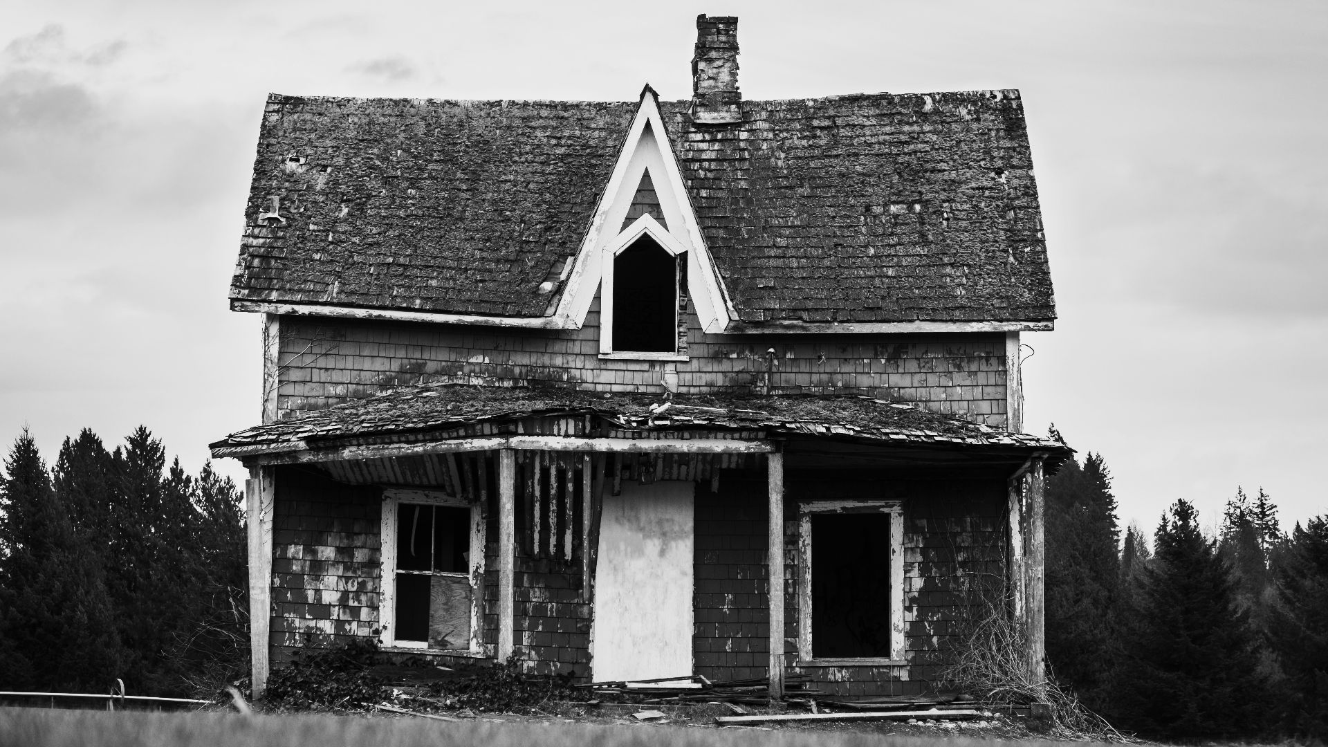 grayscale photo of wooden house