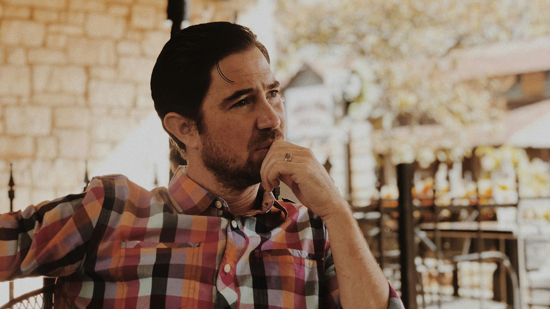 man in red and black plaid dress shirt