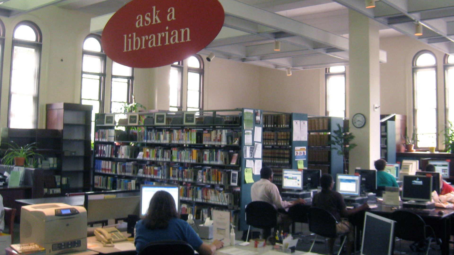 Librarian at desk with