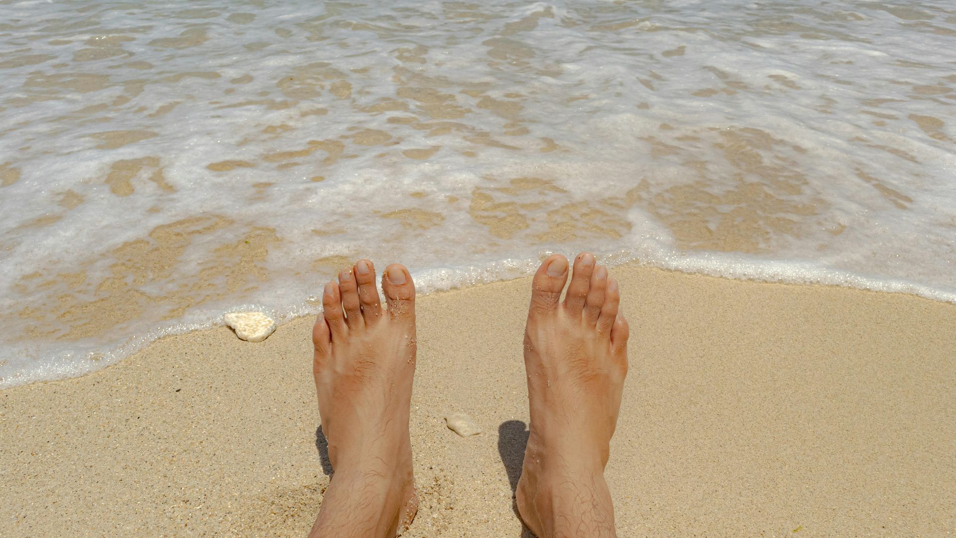Enjoying the soft sand and gentle waves. Perfect summer getaway.
