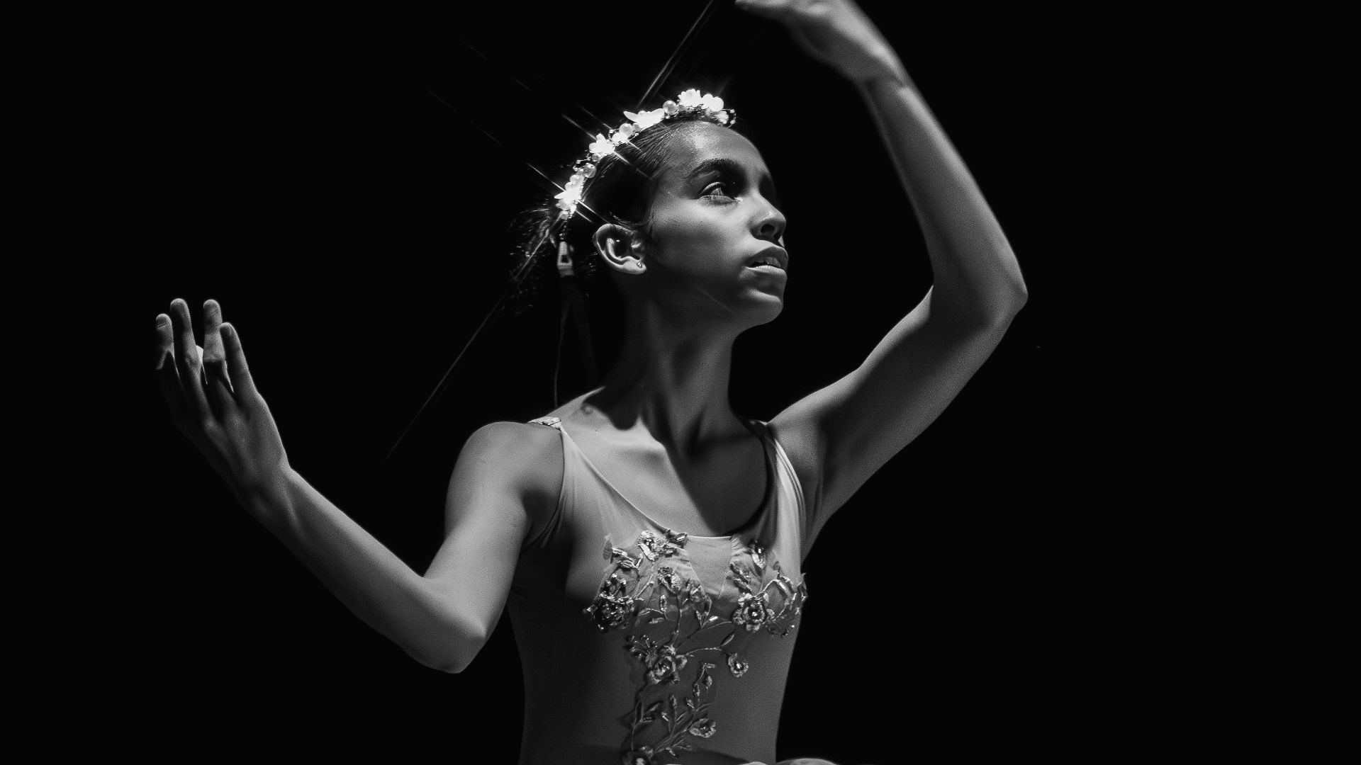 A graceful ballerina captured in dramatic black and white, showcasing the beauty of ballet.