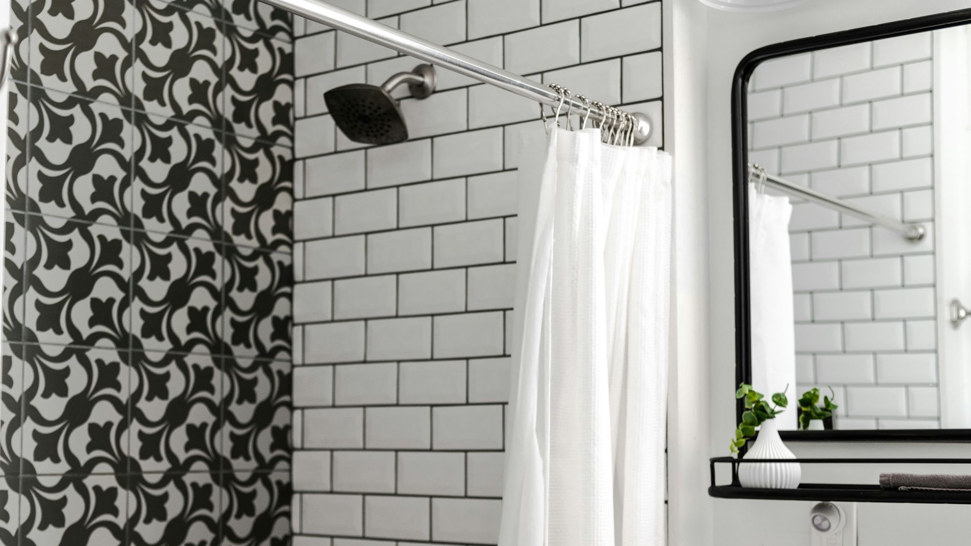 white shower curtain on stainless steel shower head