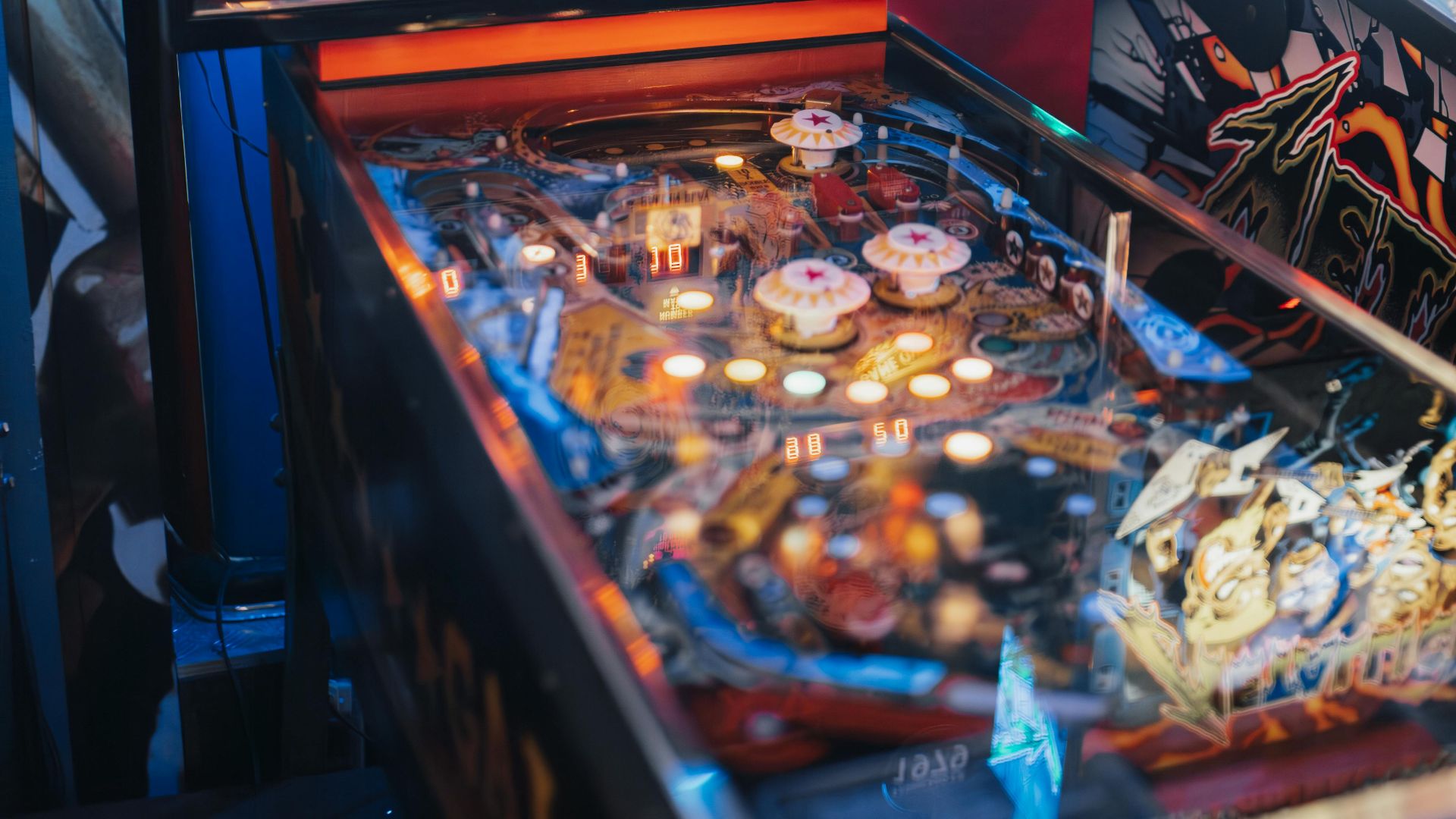 Vintage Galaxy-themed pinball machine in a vibrant arcade atmosphere, showcasing retro gaming nostalgia.