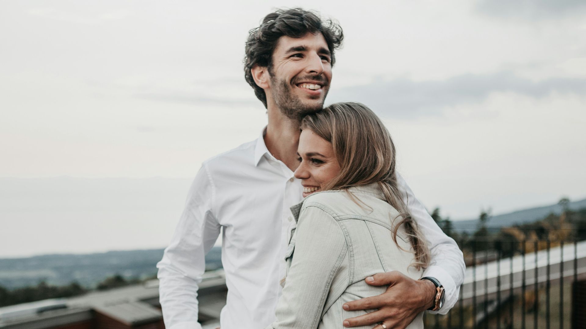 man and woman hugging each other