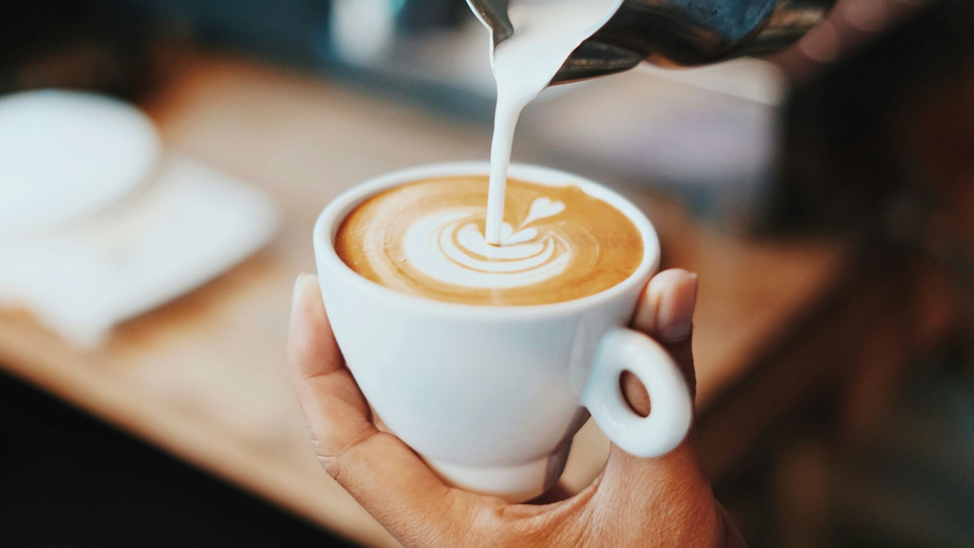 person making latte art