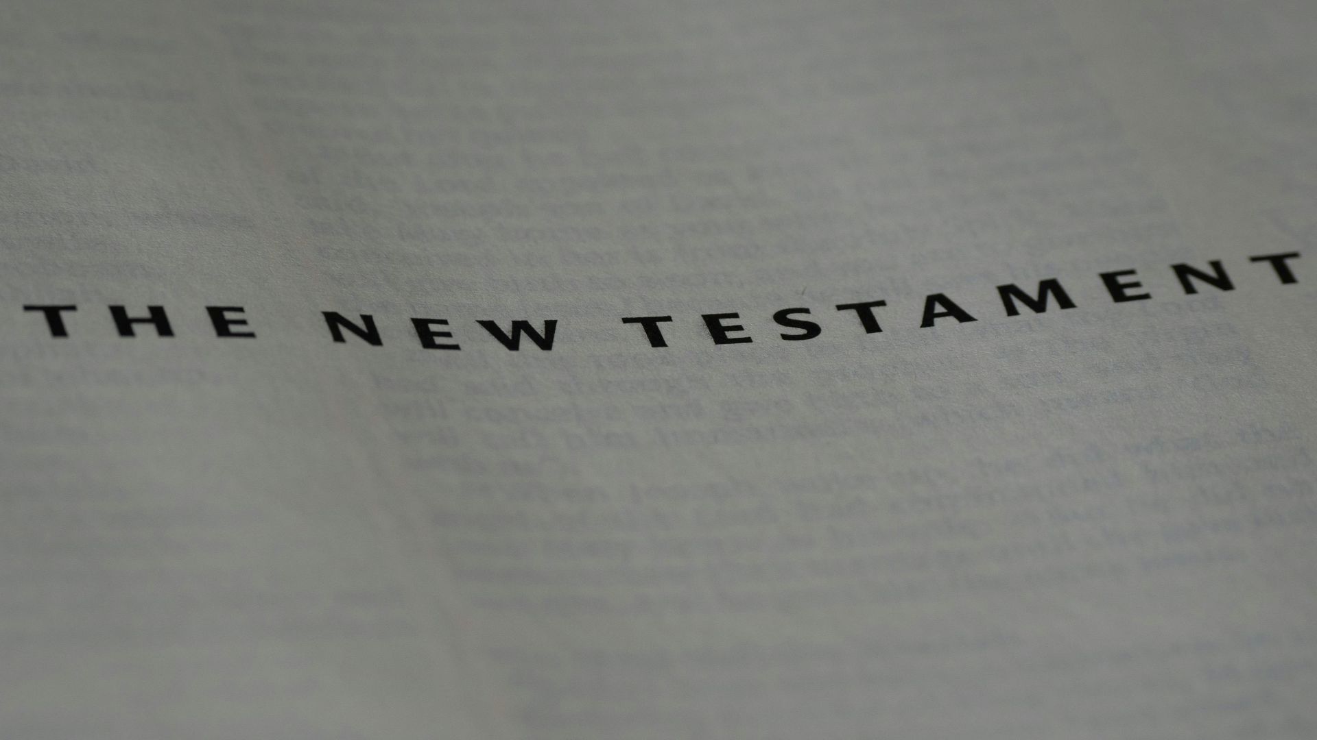 Photography of the New Testament title page in a Bible with clear focus.