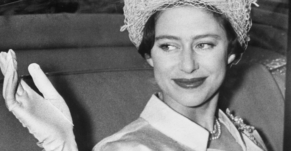Princess Margaret waves from her coach at Buckingham Palace