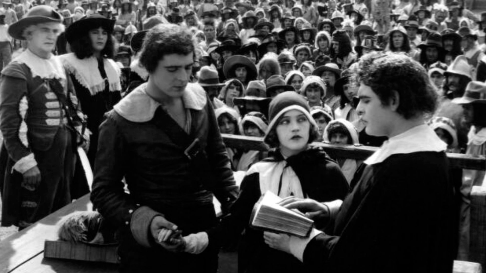 Wallace Reid (center left) and Mae Murray (center) in To Have and to Hold