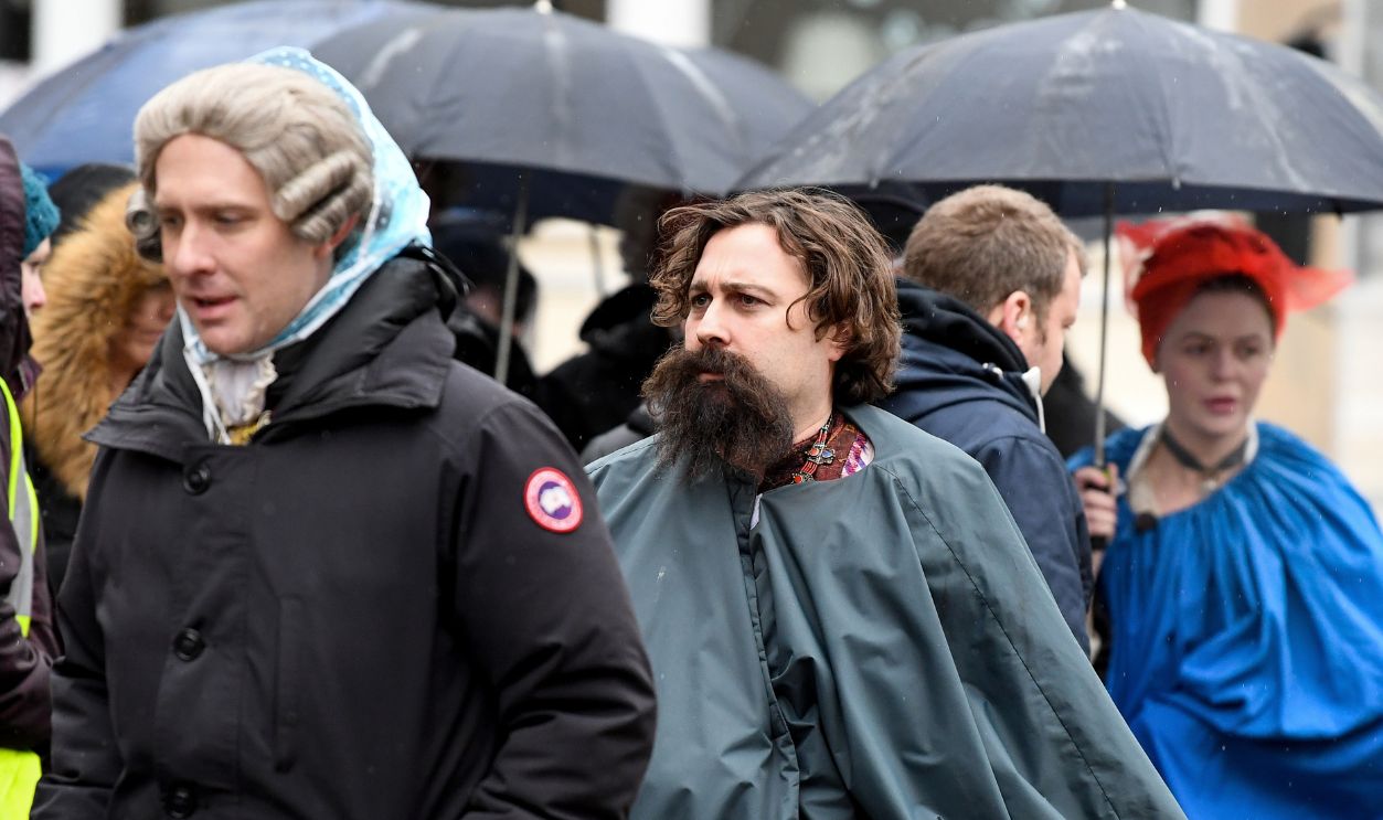 Filming Of Netflix Series Outlander Takes Place In Glasgow GLASGOW, SCOTLAND - MARCH 15: Cast and crew from the TV series Outlander arrive at a filming location at St Andrew's Square on March 15, 2018 in Glasgow, Scotland. Dozens of fans have gathered to catch a glimpse of Sam Heughan and co-star Caitriona Balfe as they filmed in the city's Salmarket area for series four of the programme.