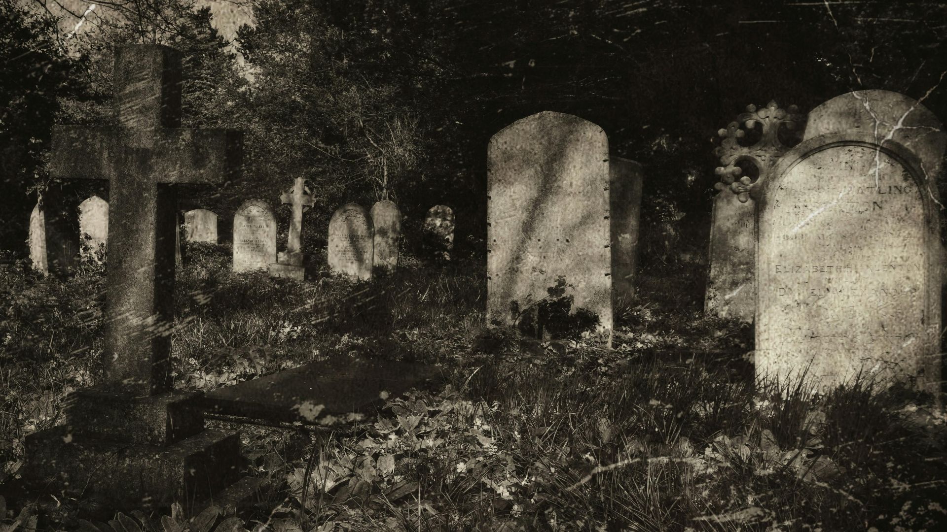 Eerie vintage-style photograph of an old cemetery with gravestones and cross under shadows.