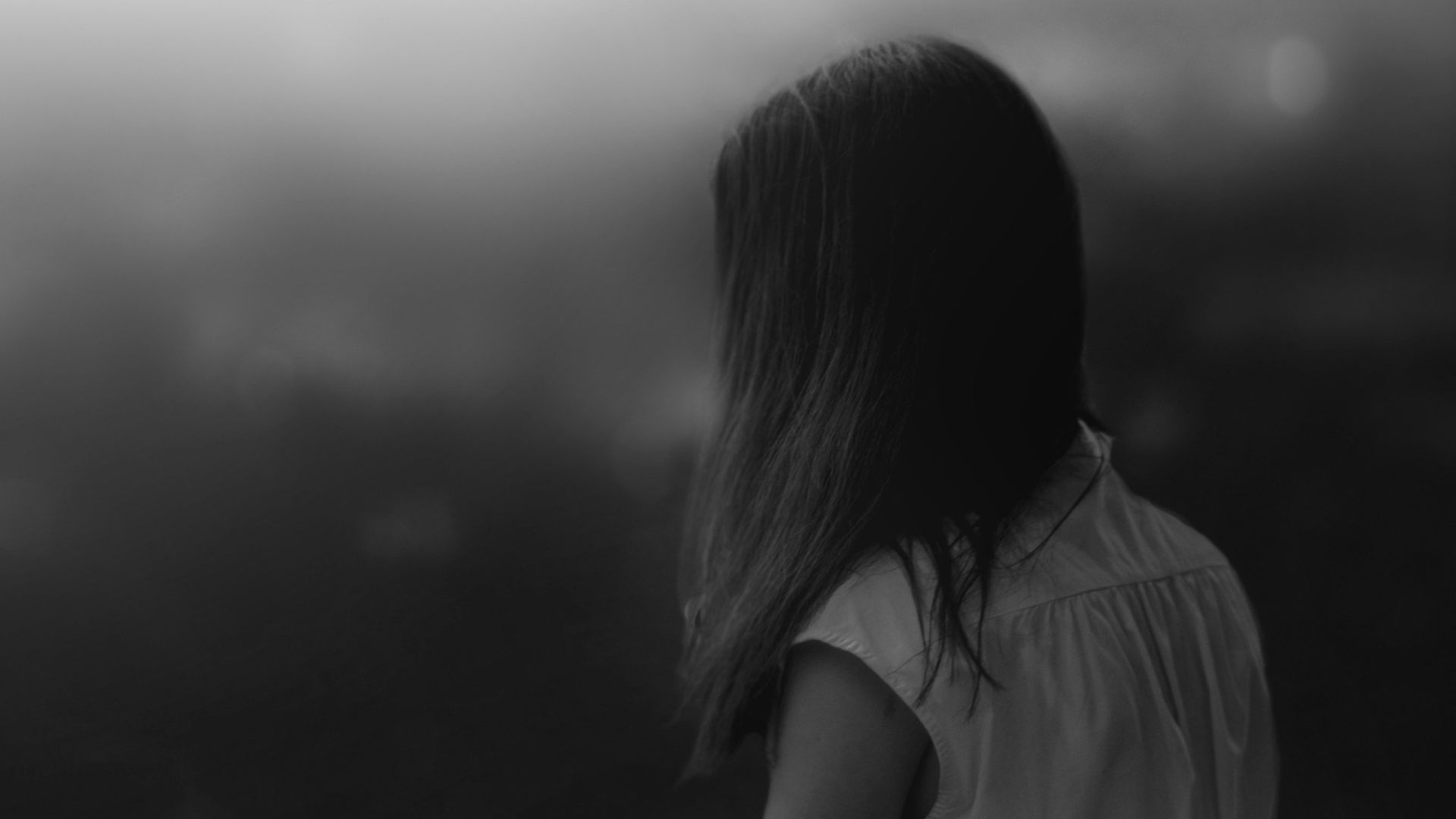 grayscale photo of woman in white shirt