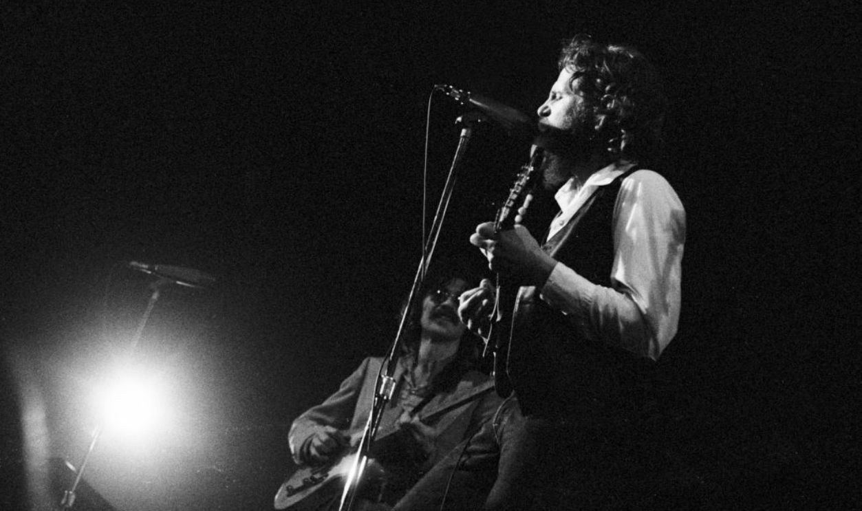 AMSTERDAM, NETHERLANDS - 1st JANUARY: Robbie Robertson (left) and Levon Helm (1940-2012) from The Band perform live on stage at the Concertgebouw in Amsterdam, Netherlands in 1972.