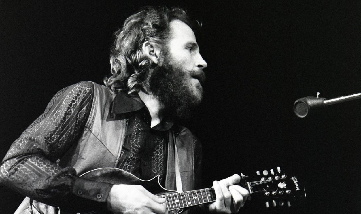Levon Helm playing Gibson mandolin, The Band, performing on stage, Doelen, Rotterdam, Netherlands, 6th June 1971. 