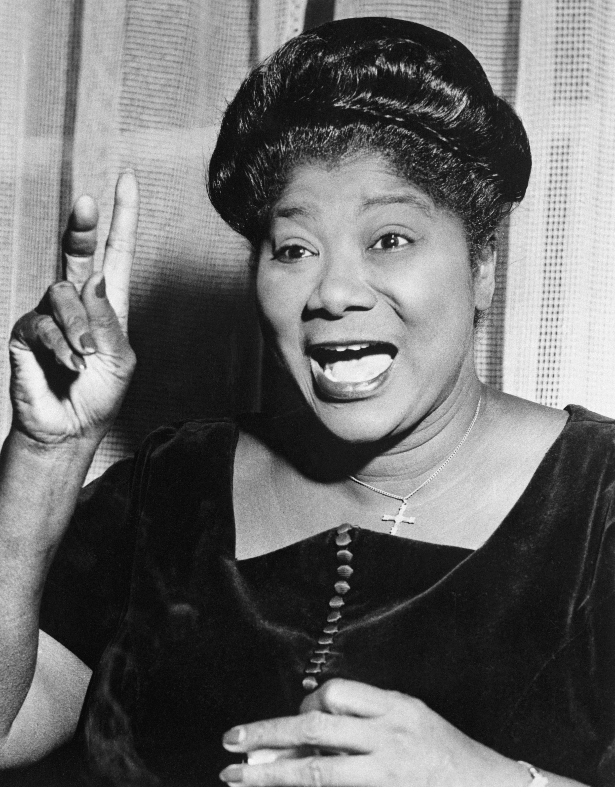 Gospel singer Mahalia Jackson gestures as she sings.