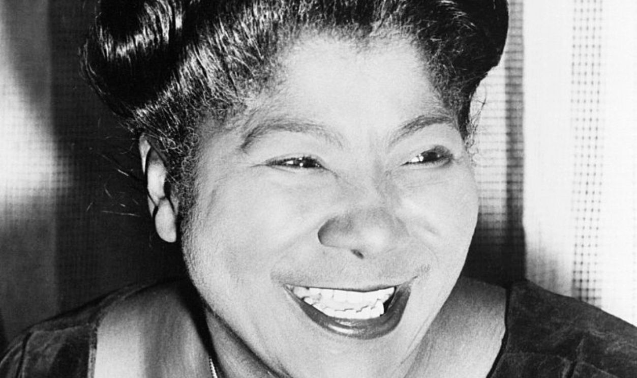 Gospel singer Mahalia Jackson smiles for a portrait.