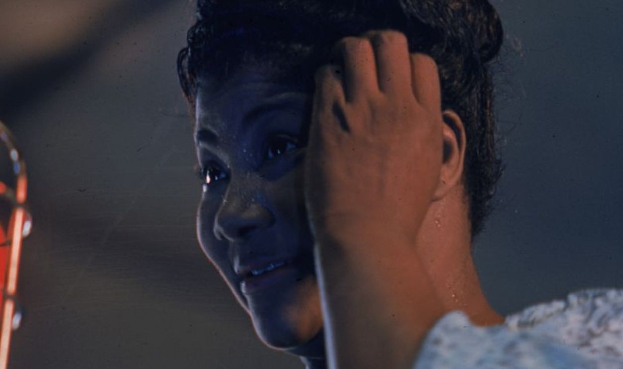 American gospel singer Mahalia Jackson (1911 - 1972) scratches her head thoughtfully.