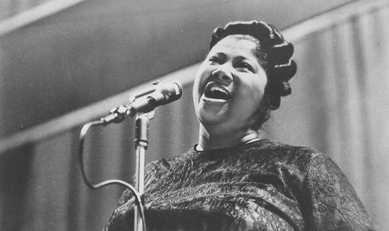 African-American singer and Queen of Gospel Mahalia Jackson singing on stage, 1959. 