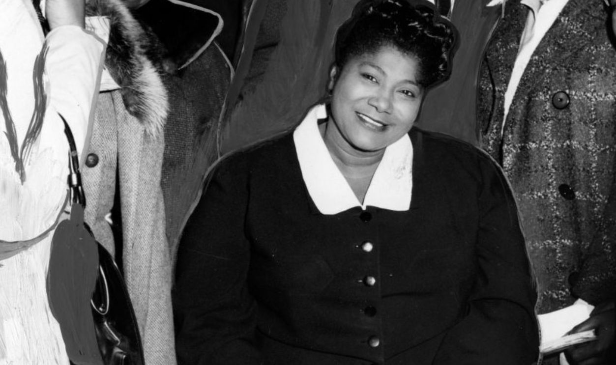 Mahalia Jackson, Gospel singer, surrounded by unidentified fans and supporters, 1965. 