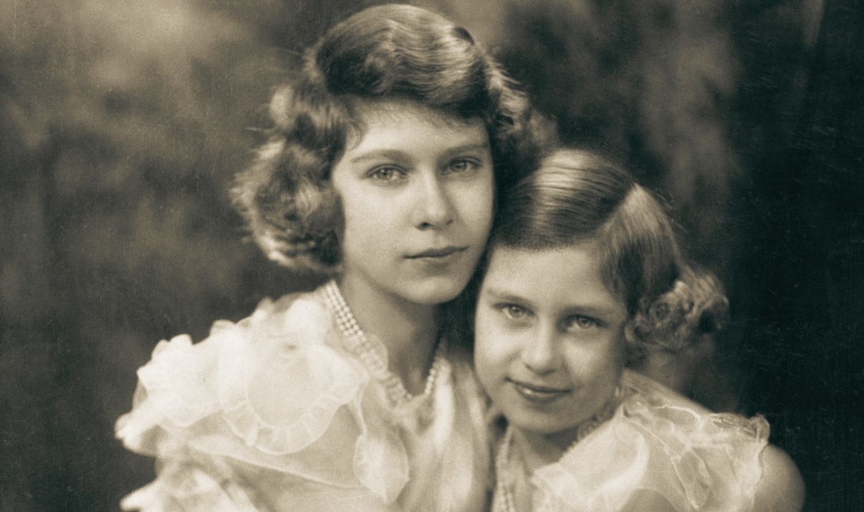 Latest Portrait Of Britain's Princesses--From war pressed England comes this charming photograph of her two best loved young ladies--the two young Princesses, daughters of King George VI. This portrait was made April 17th 1940, on the fourteenth birthday of Princess Elizabeth, who is heiress presumptive of the British Crown. Little Princess Margaret Rose is nine years old.