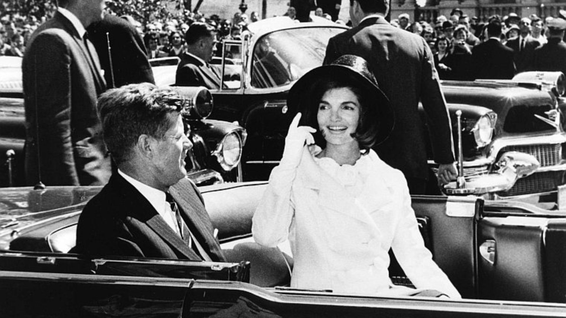 AR 7791-N  27 March 1963  Arrival Ceremonies for King of Morocco. President and Mrs. Kennedy in motorcade. Photograph by Abbie Rowe, National Park Service, in the John F. Kennedy Presidential Library and Museum, Boston.