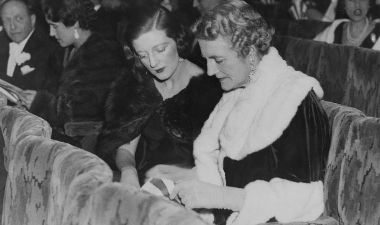 Clementine Churchill (1885 - 1977), the wife of Winston Churchill, and her daughter Diana Duncan-Sandys (1909 - 1963) attend the first night of C. B. Cochran's new show 'Follow the Sun' at the Adelphi Theatre in London, 4th February 1936.