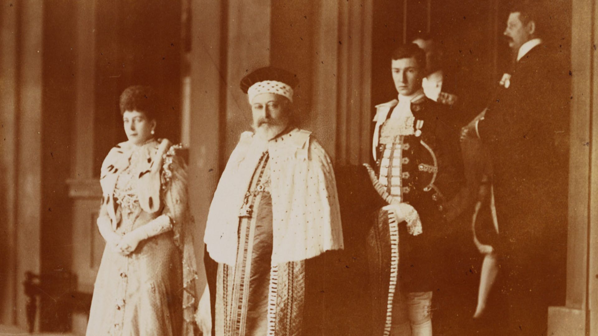 Photograph of King Edward VII and Queen Alexandra outside on the step of Buckingham Palace, on their way to their coronation