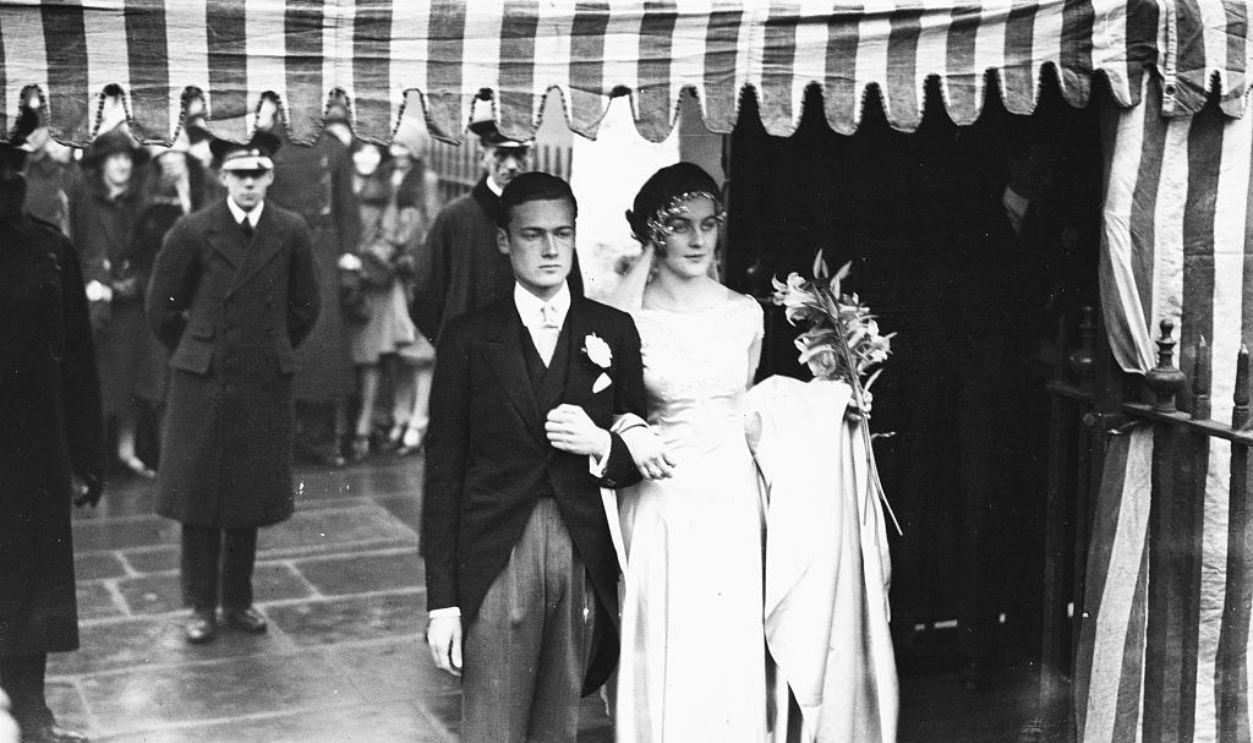Bryan Guinness, 2nd Baron Moyne, walking arm in arm with his new bride Diana Mitford, one of the noted Mitford sisters, at St Margaret's Church, London, 1929. 