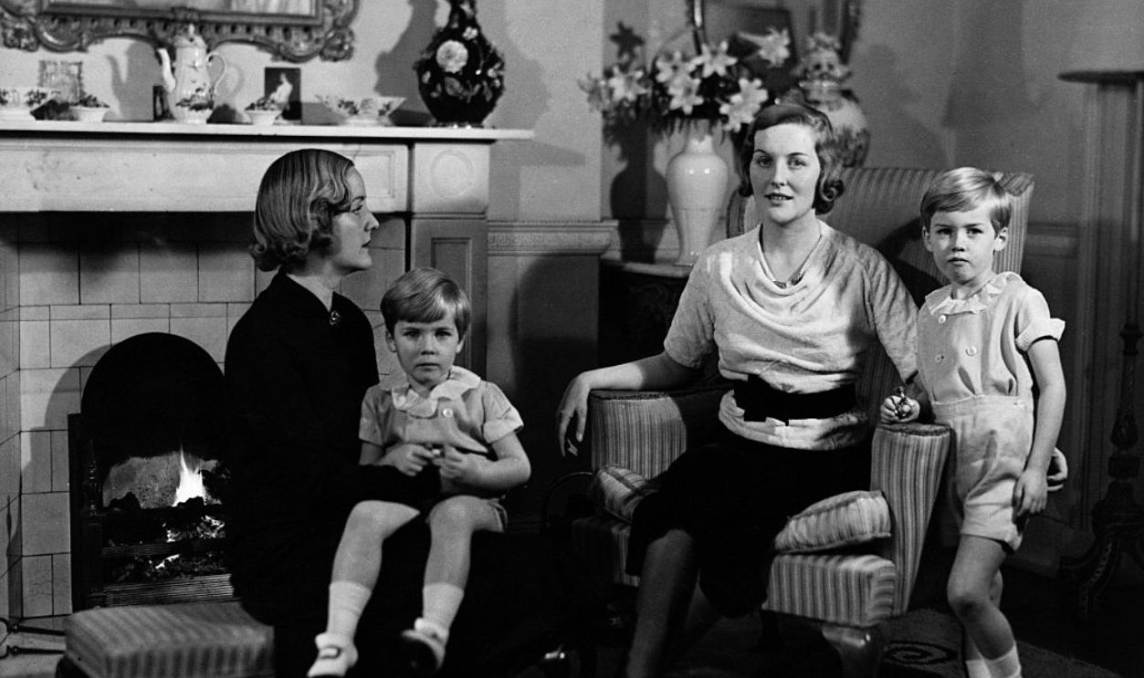 Diana Guinness relaxes with her sons and sister Unity Mitford at the home of her husband Bryan Guinness, Baron of Moyne and owner of the Guinness Brewing Company.