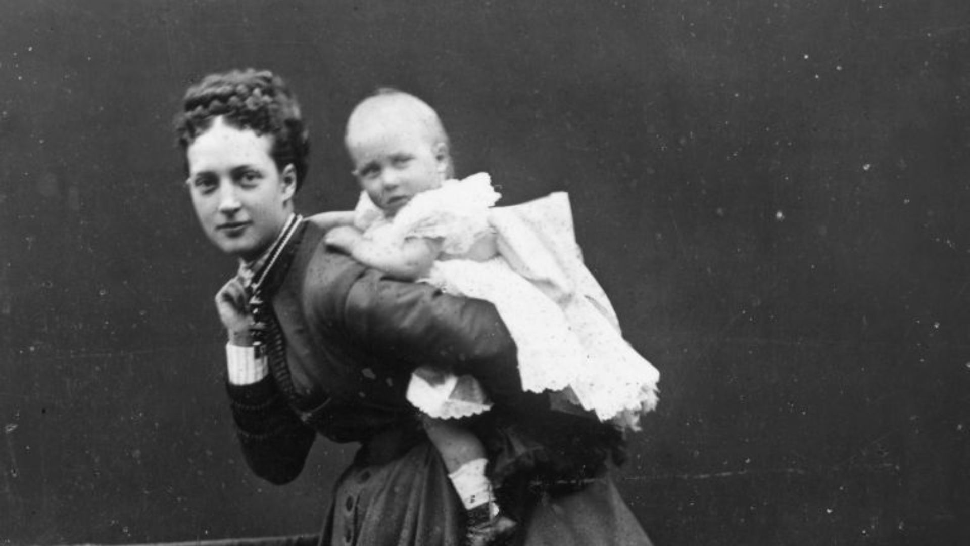 Princess Alexandra (1844 - 1925), consort of the future King Edward VII of the UK, carrying her first-born daughter Louise on her back.