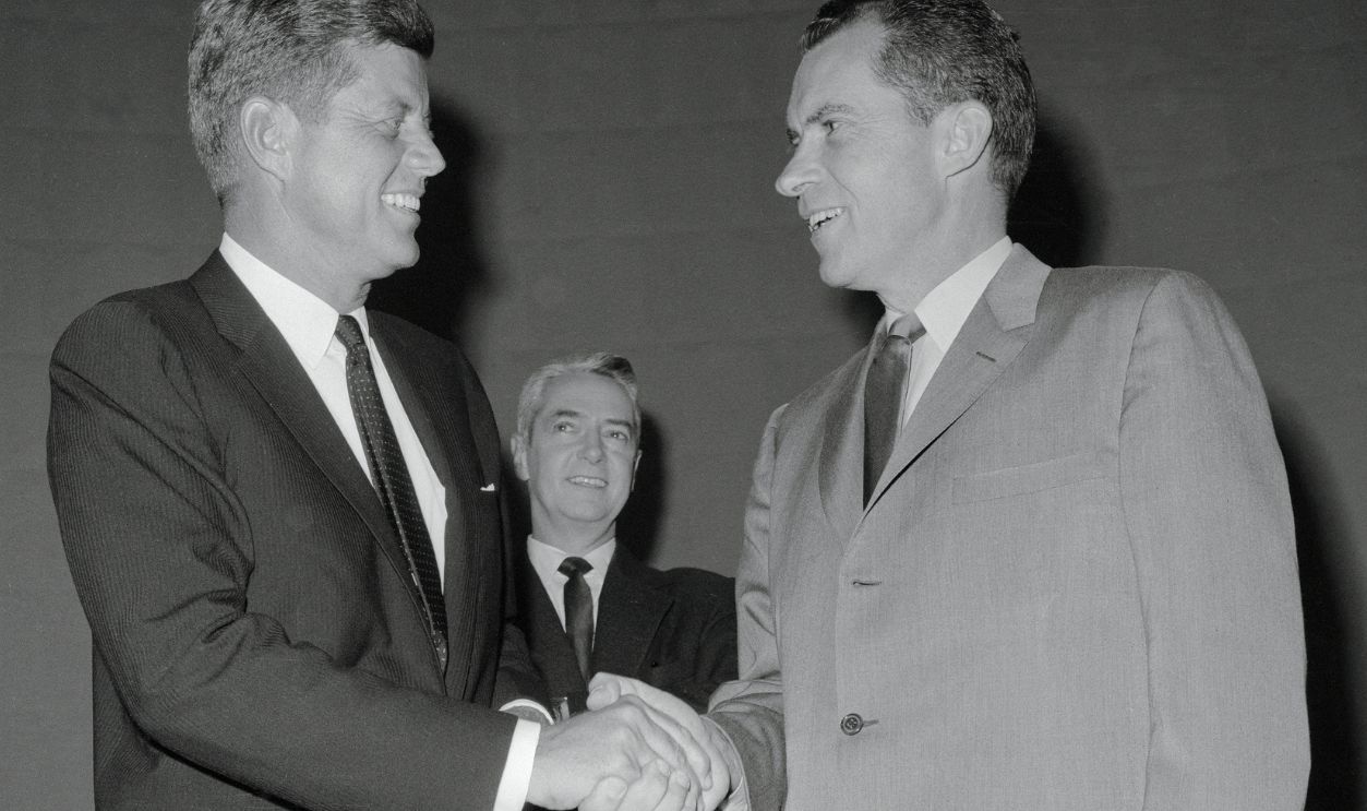 Kennedy And Nixon Before Debate Presidential rivals Senator John F. Kennedy and Vice President Richard Nixon meet for the first time just before their first nationally televised debate on domestic issues, at WBBM-TV studios, Chicago, Illinois, 26th September 1960. In center is Howard K. Smith, moderator. This was the first-ever televised presidential debate in the USA.