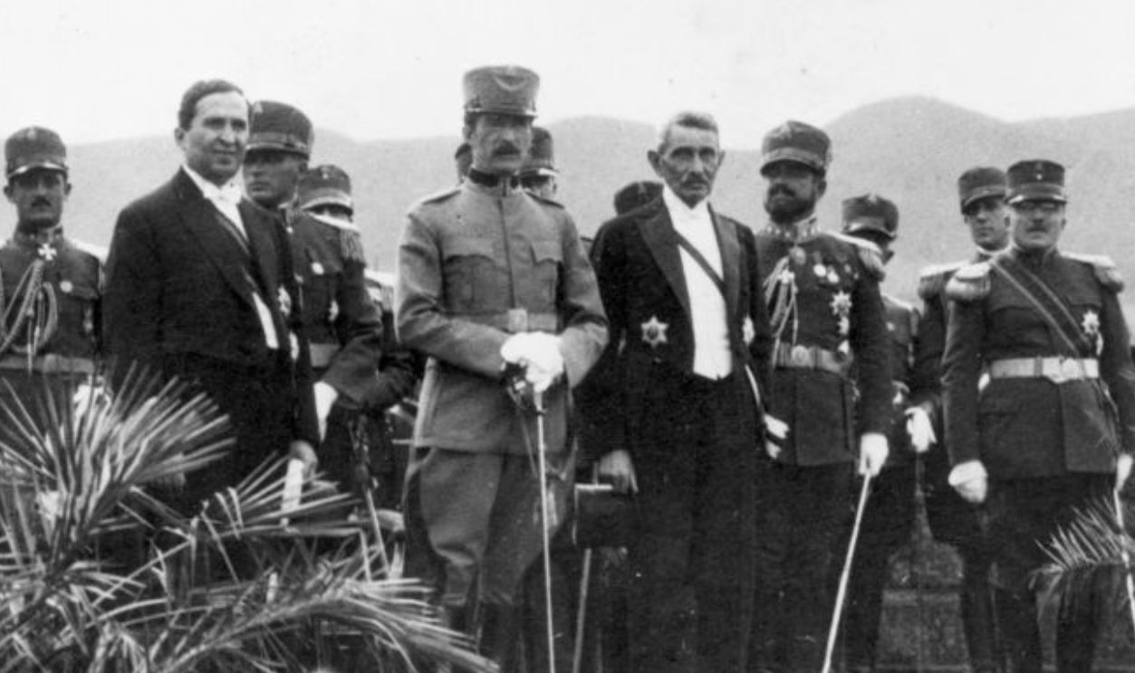 circa 1935: King Zog I of Albania (1895 - 1961) stands surrounded by his ministers during his birthday celebrations.