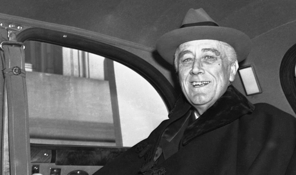 Looking tanned and fit, President Franklin Delano Roosevelt arrives at the Capitol for his speech to the assembled members of Congress. He told a cheering audience to assume responsibility for underwriting future peace through world collaboration in the same non-partisan spirit that America wages war - or to 