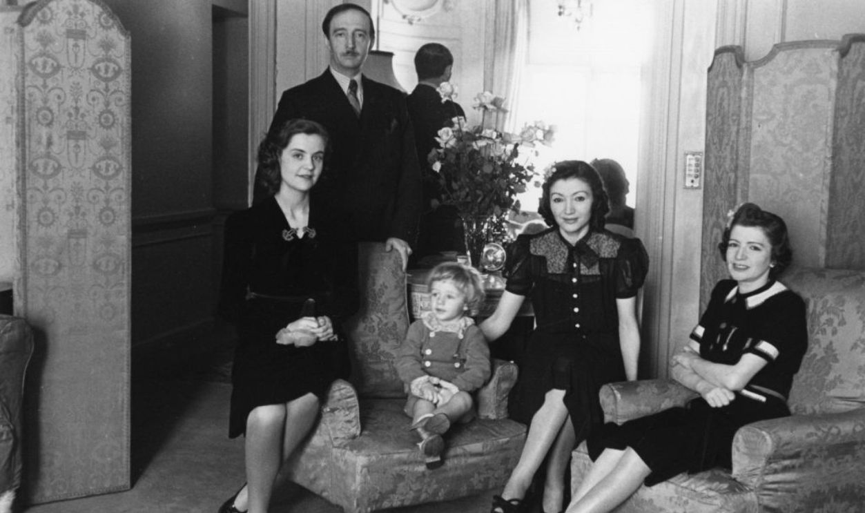 7th December 1940: King Zog I (1895 - 1961) of Albania, living in exile in London. Queen Geraldine (1915 - 2002), his son Leka and two of his sisters are with him. Original Publication: Picture Post - 346 - Albania's Chance - pub. 1940