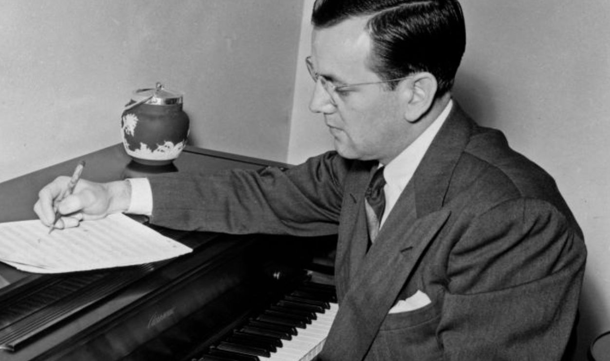 NEW YORK - CIRCA 1940: Big band leader Glenn Miller writes at and Aerosonic brand piano at home in circa 1940 in New York. 