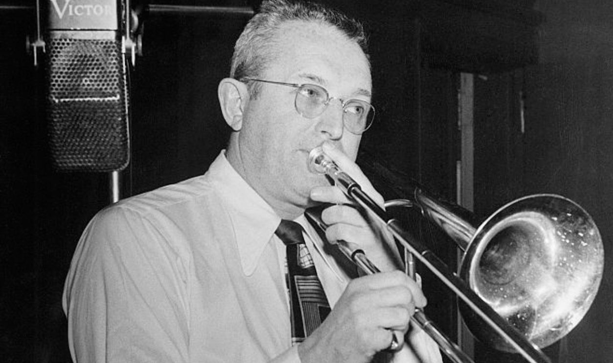 (Original Caption) Tommy Dorsey playing the trombone during a recording session. Undated photo circa 1940s.