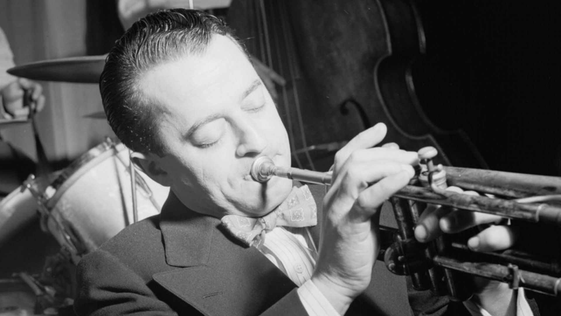 Gottlieb, William P., 1917-, photographer.
[Portrait of Max Kaminsky, Eddie Condon's, New York, N.Y., ca. Sept. 1946]
1 negative :  b&w ; 2 1/4 x 2 1/4 in.
Caption from Down Beat: Galloped back to Condon's to pick up dictaphone rolls and interrogate Max K