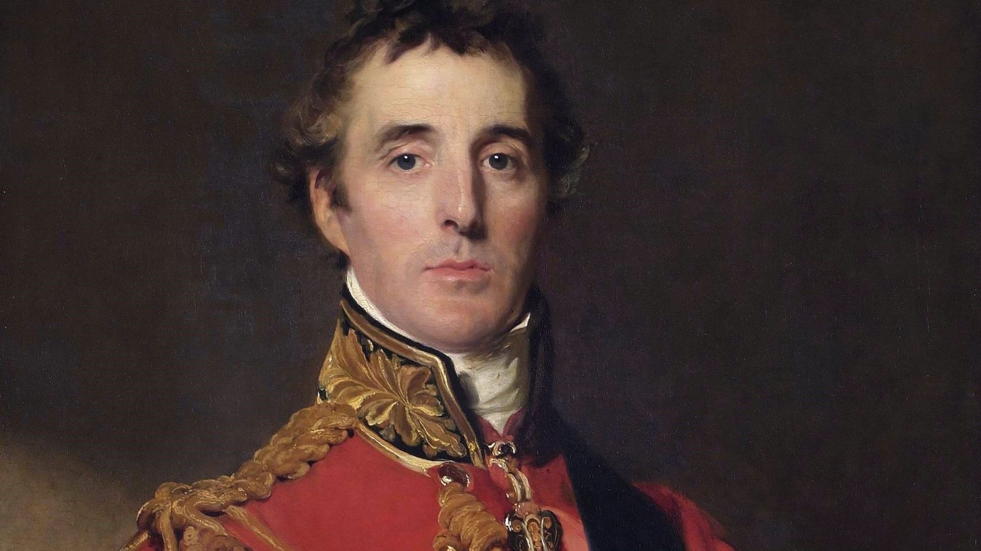 The Duke of Wellington is standing at half-length, wearing Field Marshal’s uniform, with the Garter star and sash, the badge of the Golden Fleece, and a special badge ordered by the Prince Regent to be worn from 1815 by Knights Grand Cross of the Military