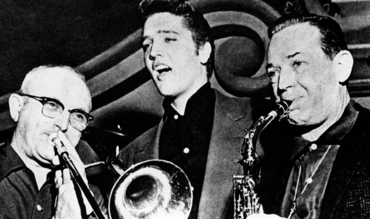 UNITED STATES - JANUARY 01: USA Photo of Jimmy DORSEY and Tommy DORSEY and Elvis PRESLEY, L - R: Tommy Dorsey, Elvis Presley, Jimmy Dorsey - performing live on stage, on 'Dorsey Brothers Stage Show' 