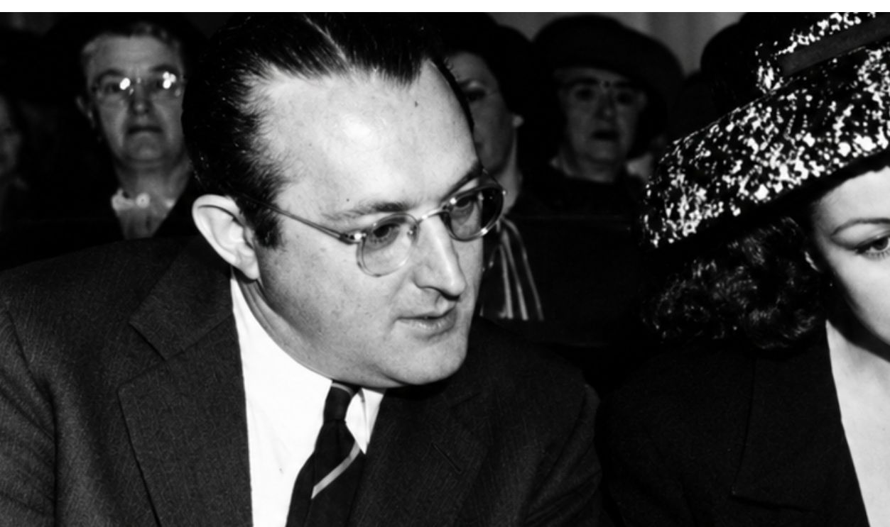 27th November 1944: American bandleader Tommy Dorsey (1905 - 1956) (left), his wife Pat Dane and their attorney Isaac Pacht during their trial in Los Angeles, California. The couple are facing assault charges after the attack on film actor Jon Hall. 
