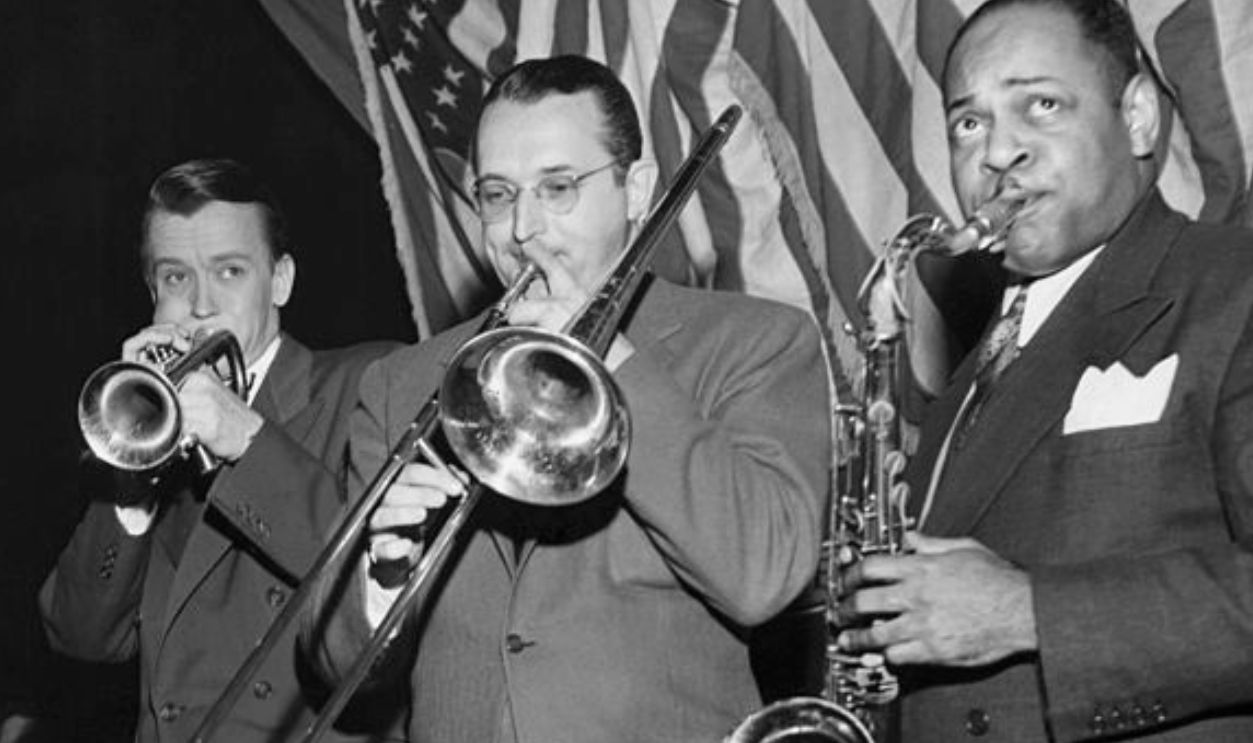 (Original Caption) Recently a group of famous band leaders got together for a jam session at the Manhattan Center in New York City. The audience went wild with enthusiasm over the band and its swell music. Left to right: John Kirby (bass), Bobby Sherwood (trumpet), Tommy Dorsey (trombone), and Coleman Hawkins. Undated photograph.