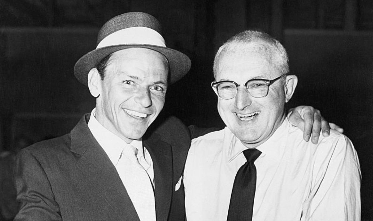 (Original Caption) 1956-New York, NY: Frank Sinatra and Tommy Dorsey turn back the clock as they prepare to rehearse their upcoming stage show at the Paramount Theatre, where Frank's new starring motion picture, 