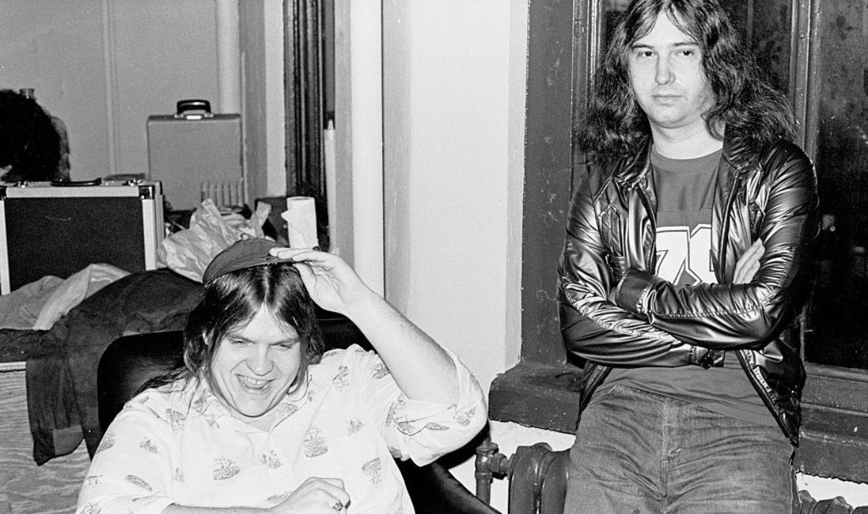 View of American musician Meat Loaf (born Marvin Lee Aday) (left) and musician, songwriter, and producer Jim Steinman as they stand in a doorway at a rehearsal loft, New York, New York, November 10, 1977.