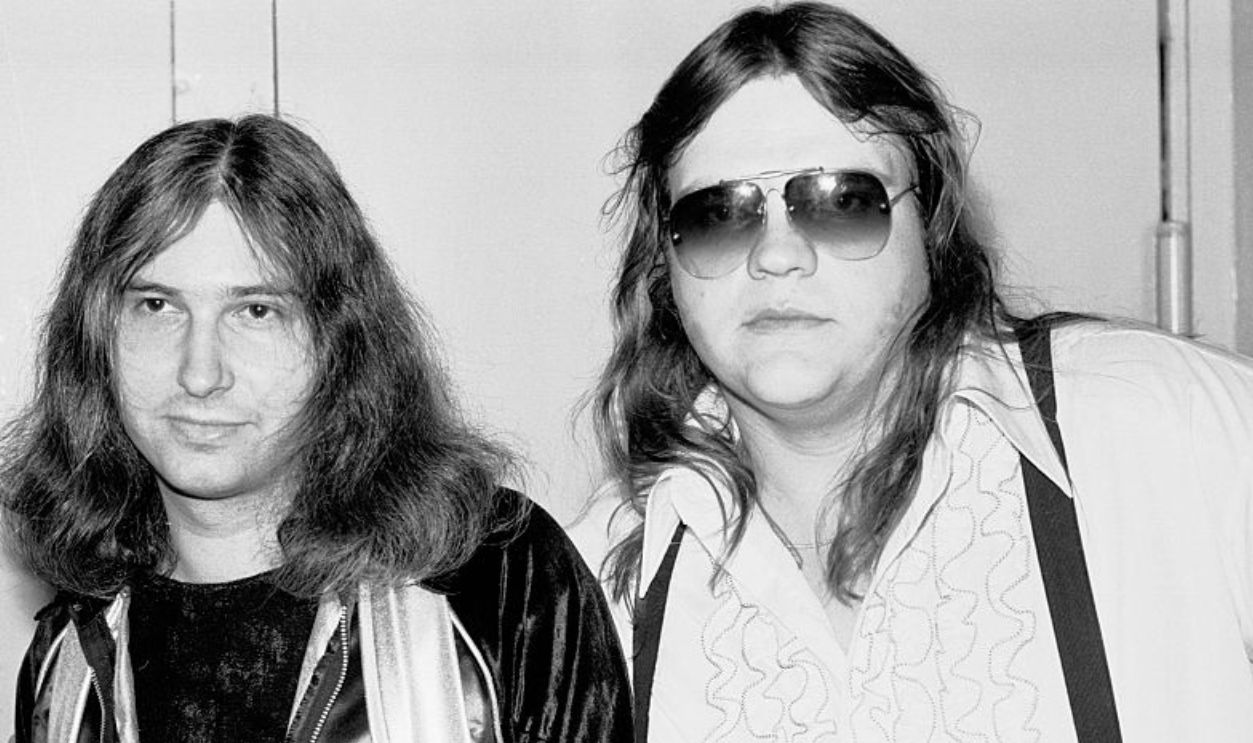 Portrait of American musician, songwriter, and producer Jim Steinman (left) with musician Meat Loaf (born Marvin Lee Aday) as they pose together backstage at My Father's Place nightclub, Roslyn, New York, November 22, 1977.