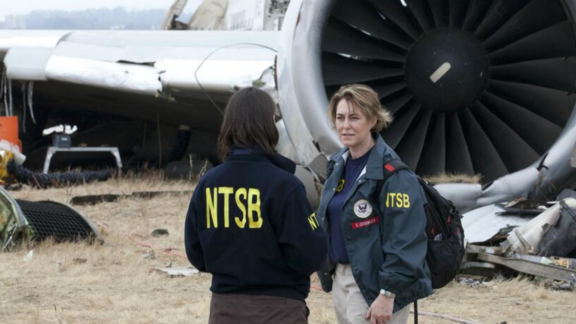 NTSB Chairman Deborah Hersman receives overview of Asiana Airlines Flight 214 accident site by NTSB engineer Erin Gormley.