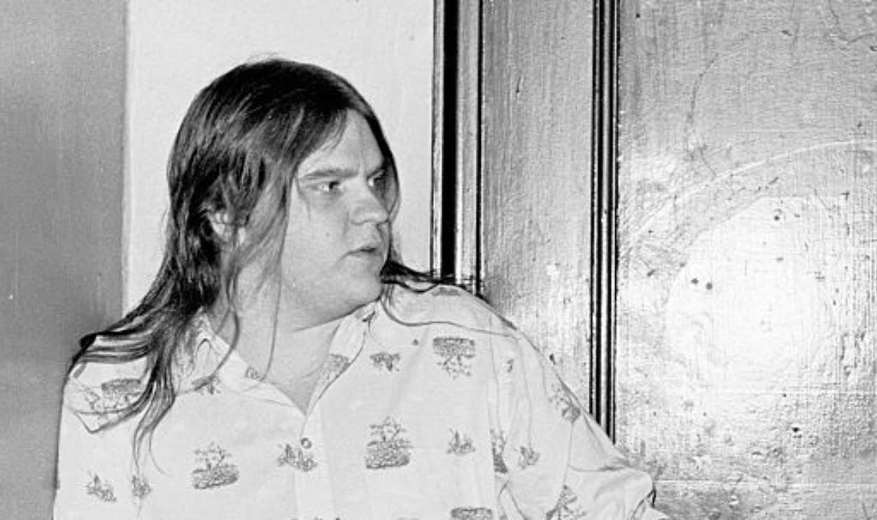 Portrait of American musician Meat Loaf (born Marvin Lee Aday) (left) and musician, songwriter, and producer Jim Steinman as they stand in a doorway at a rehearsal loft, New York, New York, November 10, 1977.