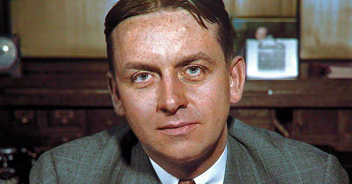 American FBI agent Eliot Ness (1903 - 1957), who headed the investigation of Chicago mobster Al Capone, sits behind his desk, 1930s.